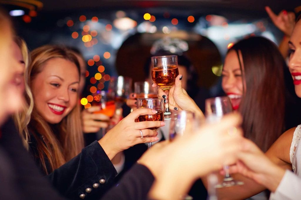 Friends enjoying a night out with limousine service
