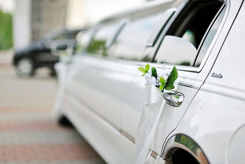 White stretch limousine decorated for a wedding